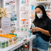 Woman shopping in pharmacy: What can I buy with my HSA?