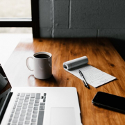 Computer sitting on a desk for research: 2023 health insurance price comparison tool requirements